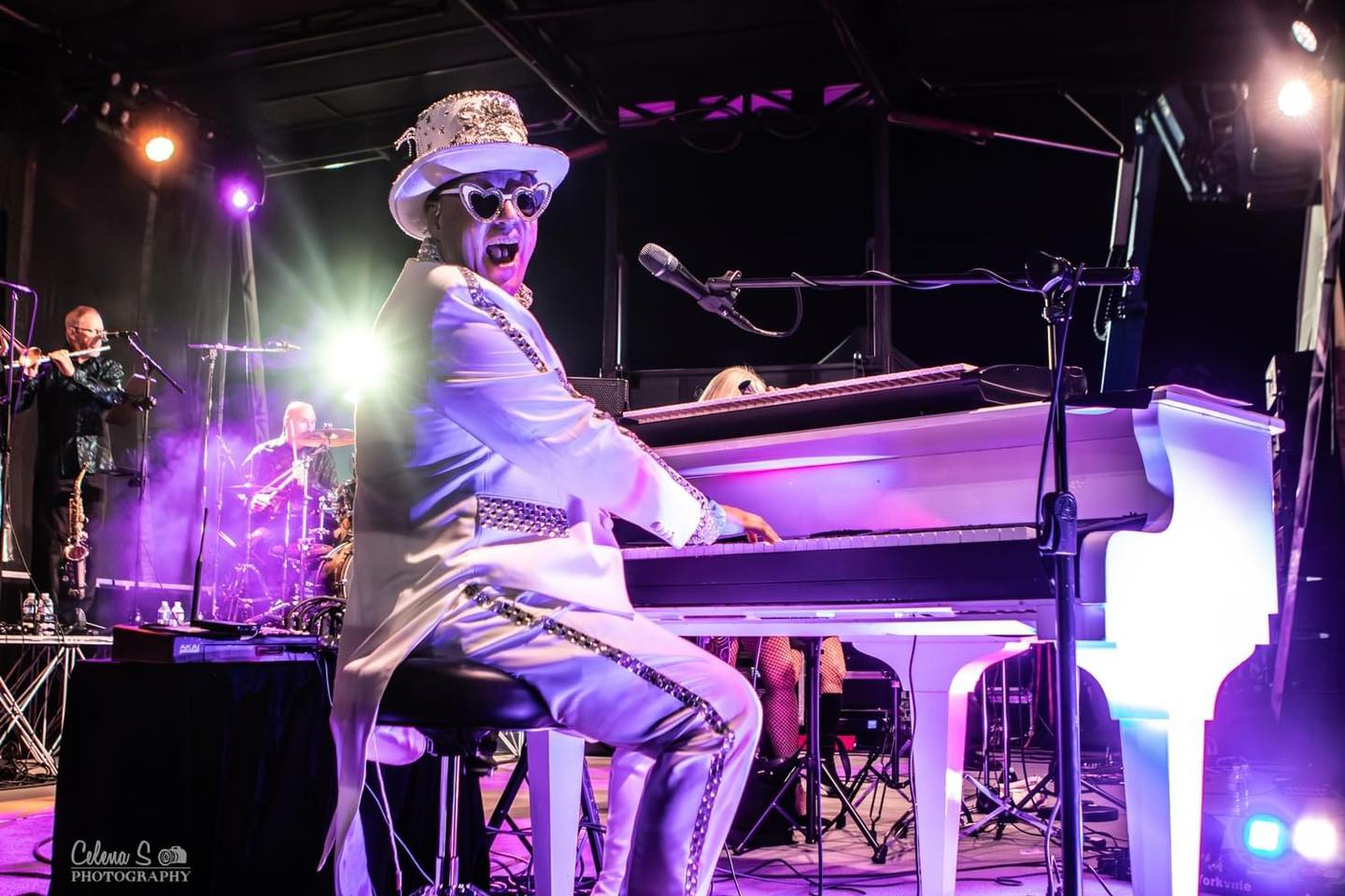 Andrew Johns, Elton John Tribute artist, sitting at a piano. He will be performing at the RE/MAX Tribute Night.